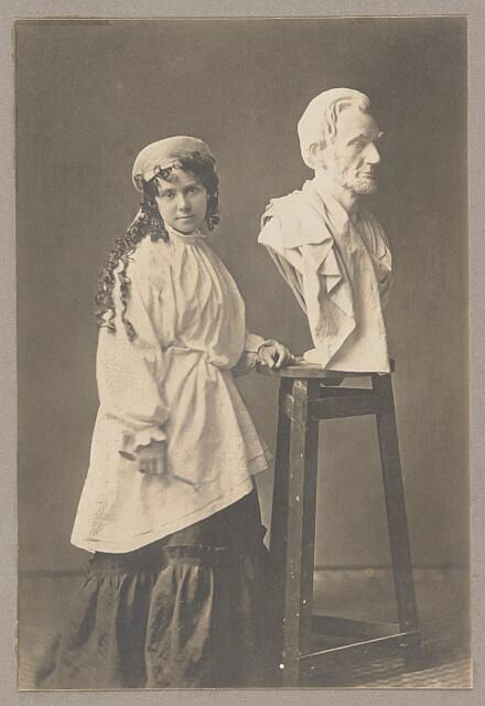 "Vinnie Ream at work upon her Lincoln bust which rests upon the stand she used in the White House while President Lincoln posed for her", photograph taken between 1865-1870, Library of Congress