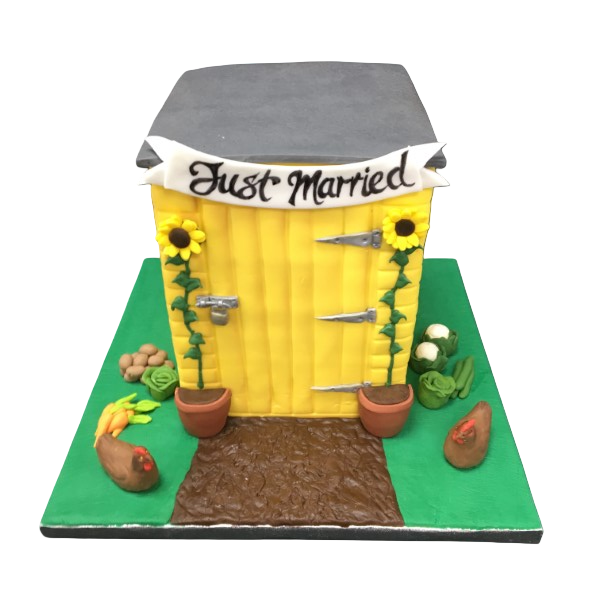 Rustic wedding cake with yellow sugar paste, sunflowers, and "Just Married" banner.