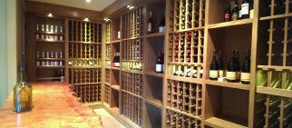 Wooden wine racks filled with bottles, Wine Room, interior design, Seattle custom wine cellar.