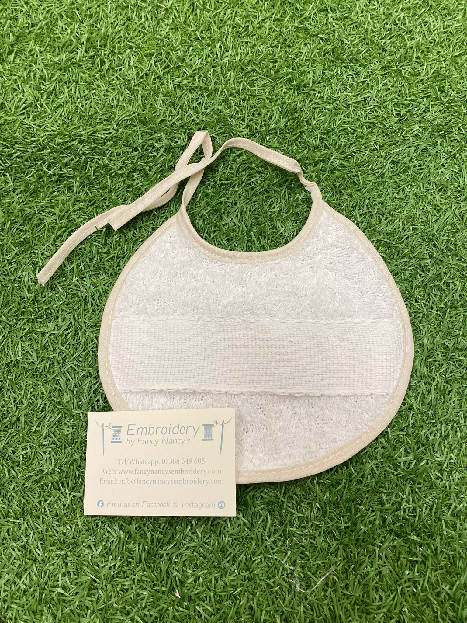 Off White/Light Tan Edged Round Toweling Bib 