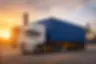 shipping container truck in UAE industrial area with cargo containers