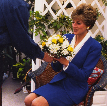 Diana, Princess of Wales receiving a bunch of flowers from a patient at Mildmay