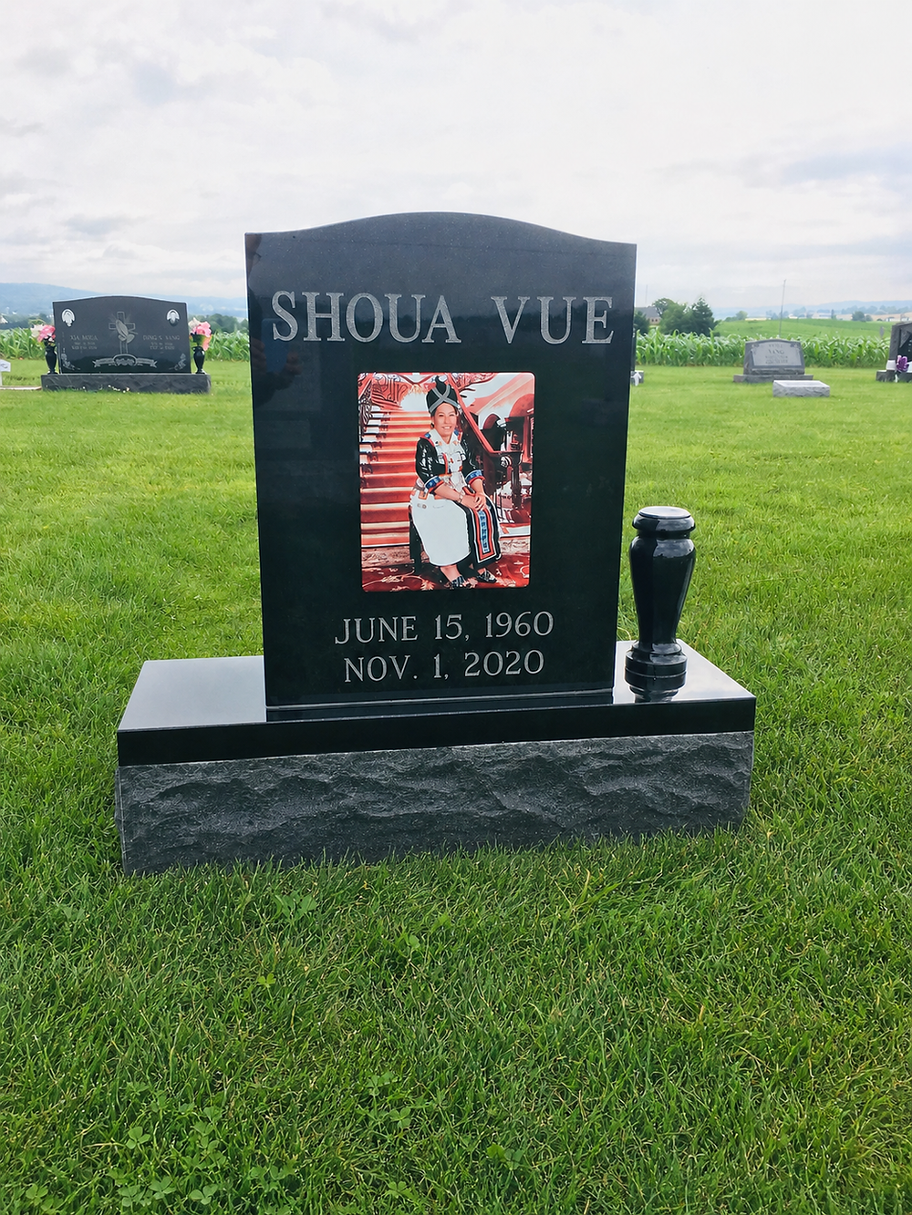 custom granite memorial with carved details and engraved lettering