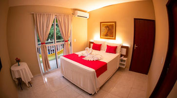 Quarto com cama na Pousada o Caribe de Maragogi 11