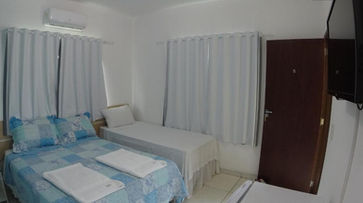 Quarto com cama no Cantinho da Melão 5