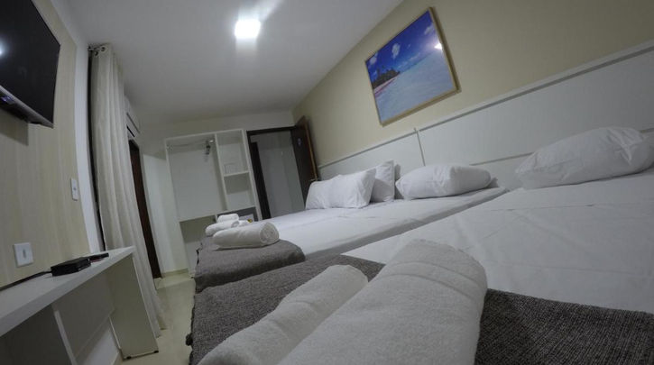 Quarto com cama na Pousada Kanoas