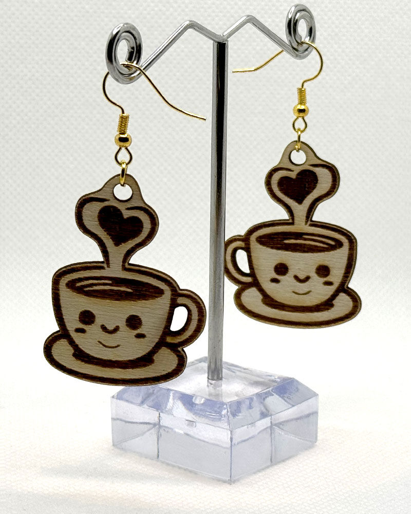 Thumbnail: Kawaii cappuccino laser engraved earrings hanging against a white background
