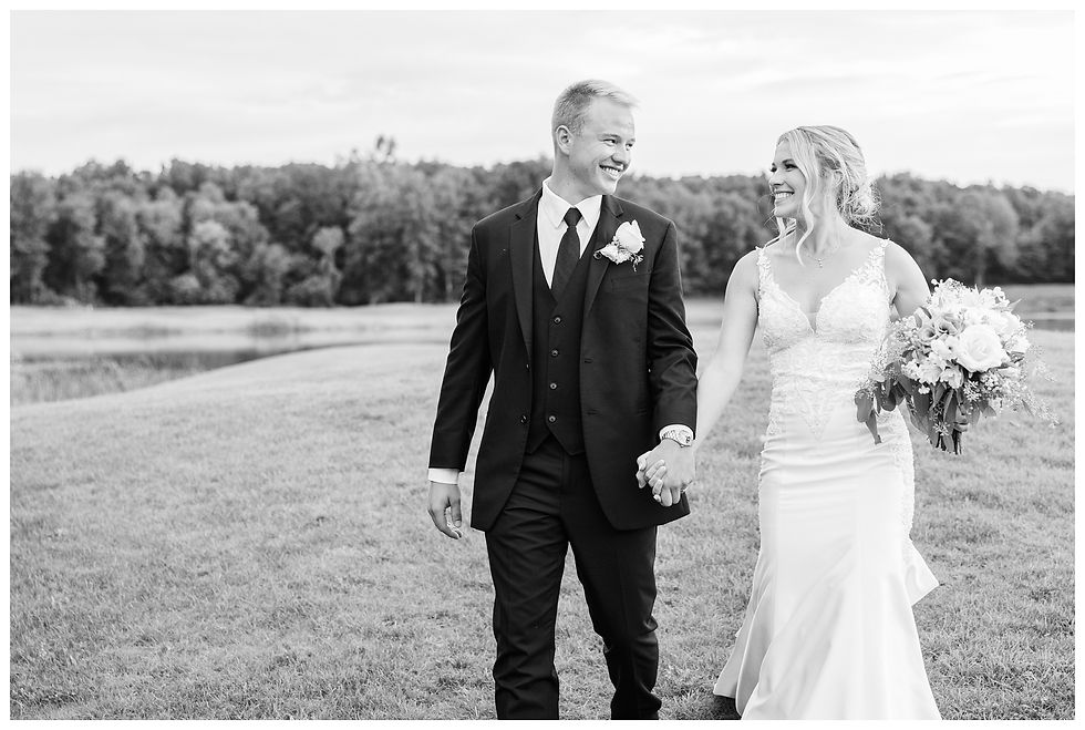 elegant black suit white chapel wedding near Lansing michigan by josh and Andrea photography