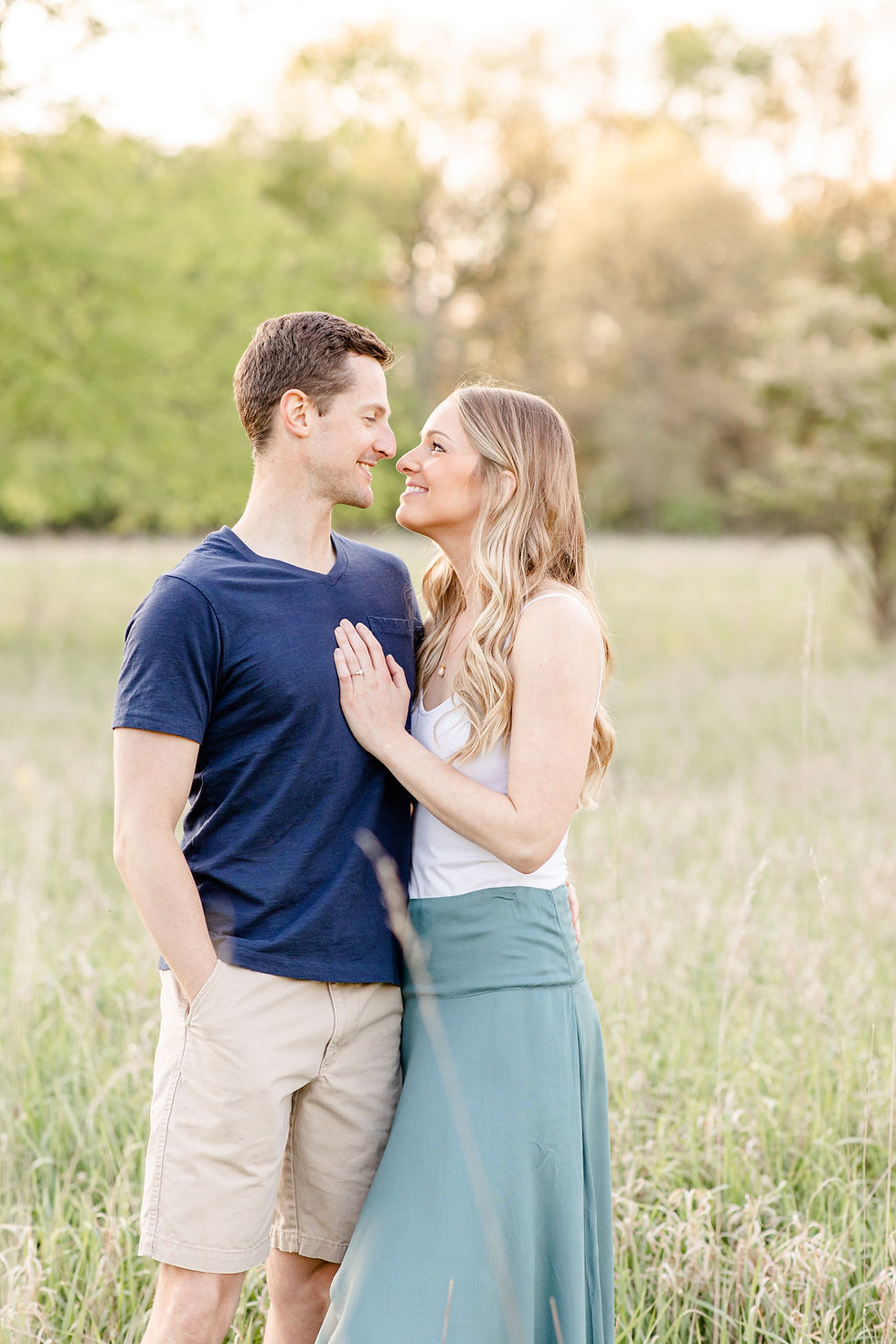 Josh and Andrea wedding photography husband and wife photographer team michigan Al Sabo Land Preserve engagement pictures session photo shoot fiance woods field smiling
