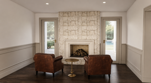 Intimate sitting area with stone fireplace, two brown leather chairs, traditional wall molding, brass side table, and dark hardwood floors.