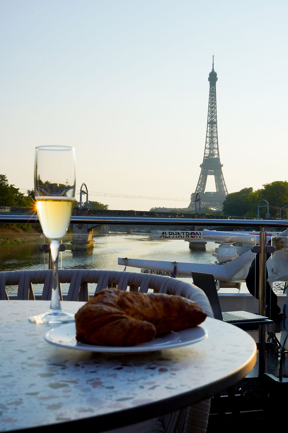 Sunrise over the Eiffel Tower viewed from VIVA BEYOND during a luxury Seine river cruise in Paris.