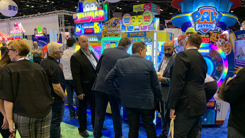 Ticket Man was among the new games on display in Andamiro booth No. 1,300. Players guide the Ticket Man magnet over a rotating vat of metal coins to pick them up. Each coin has a ticket value.