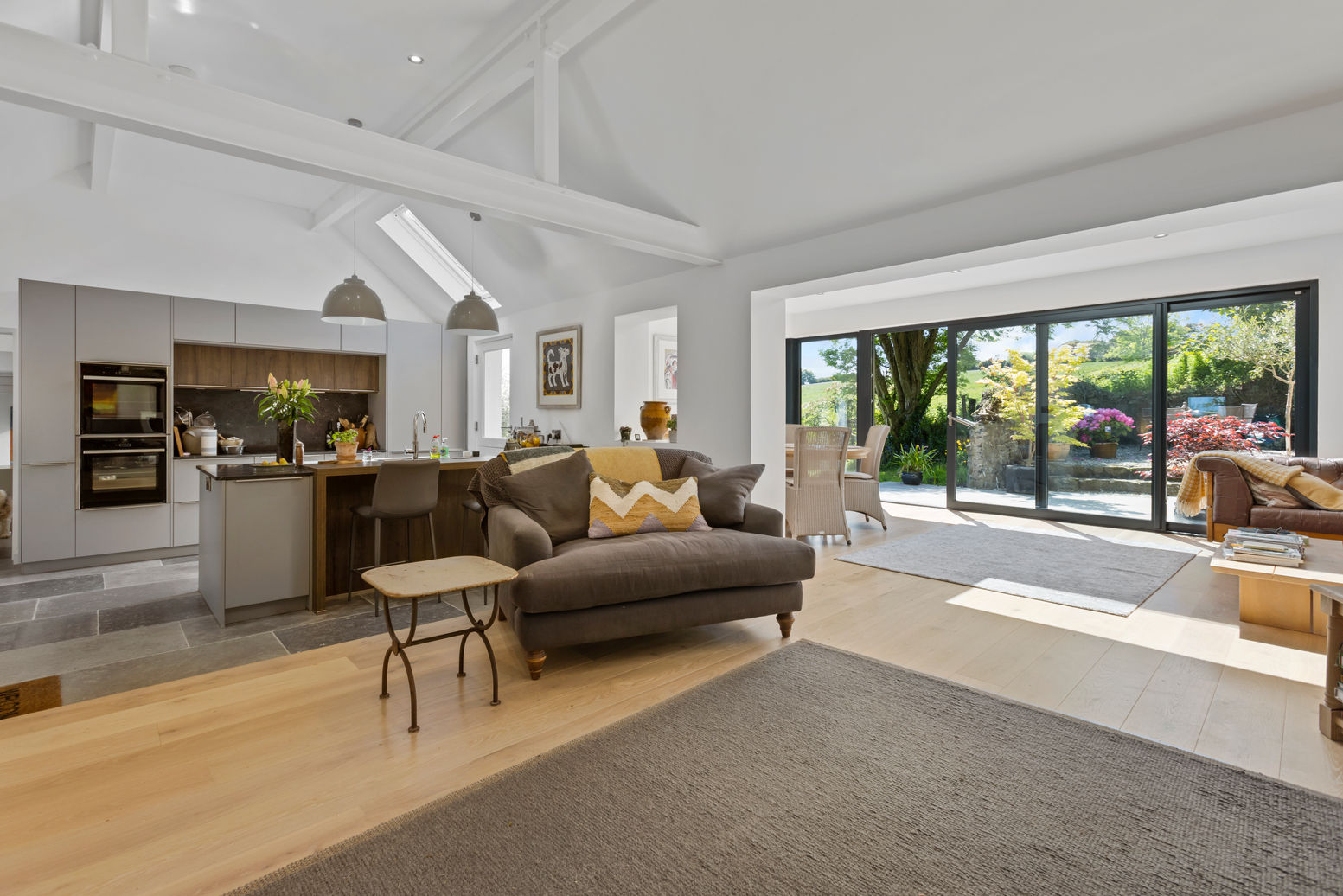 Modern kitchen and living area with stunning glazed extension, recently completed by AMD Homes Ltd