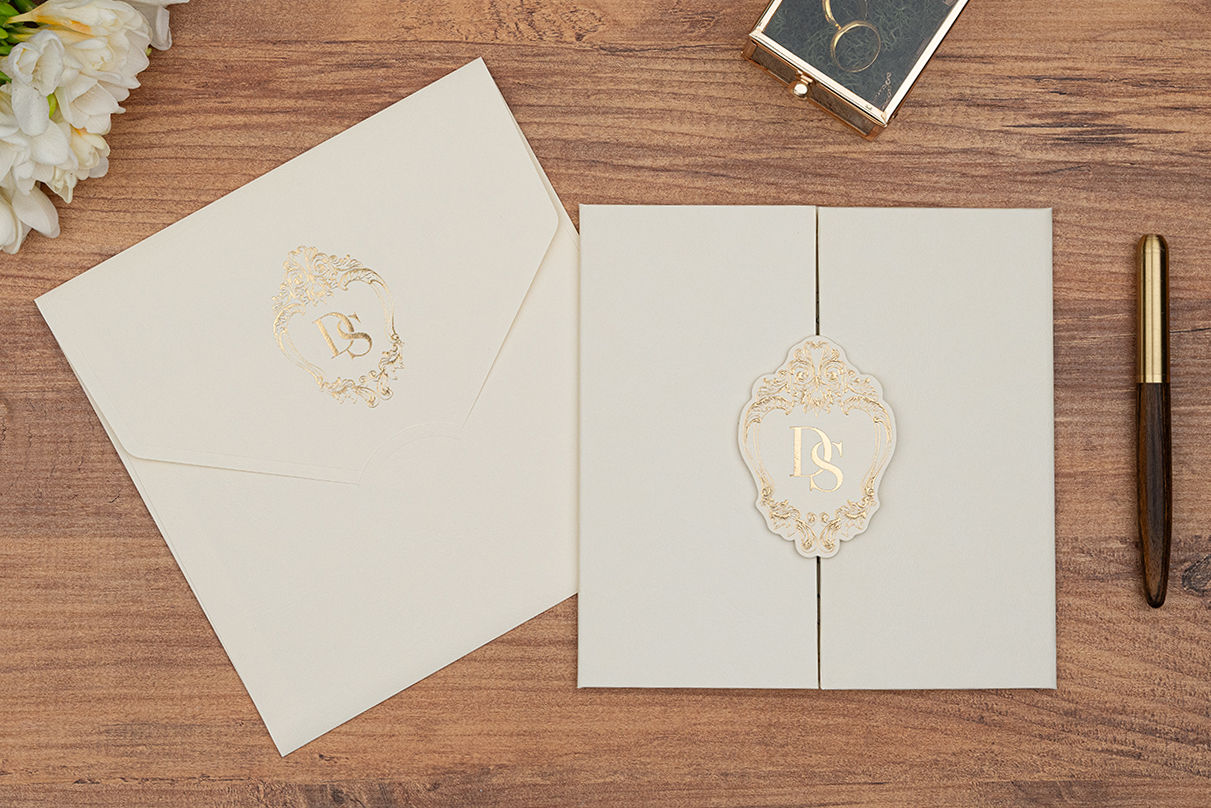 Elegant wedding invitation with gold foil monogram