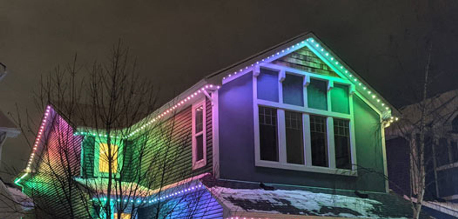 Home in Sandy, Utah outlined in permanent LED roofline lighting at night