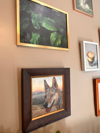 gallery wall with framed paintings