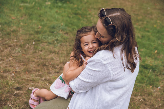 cute mother and daughter moment captured during photoshoot