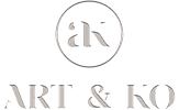 A white and gold company logo for Art & Ko