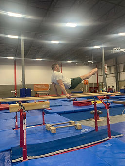 Man Swinging on Parallel Bars.jpg