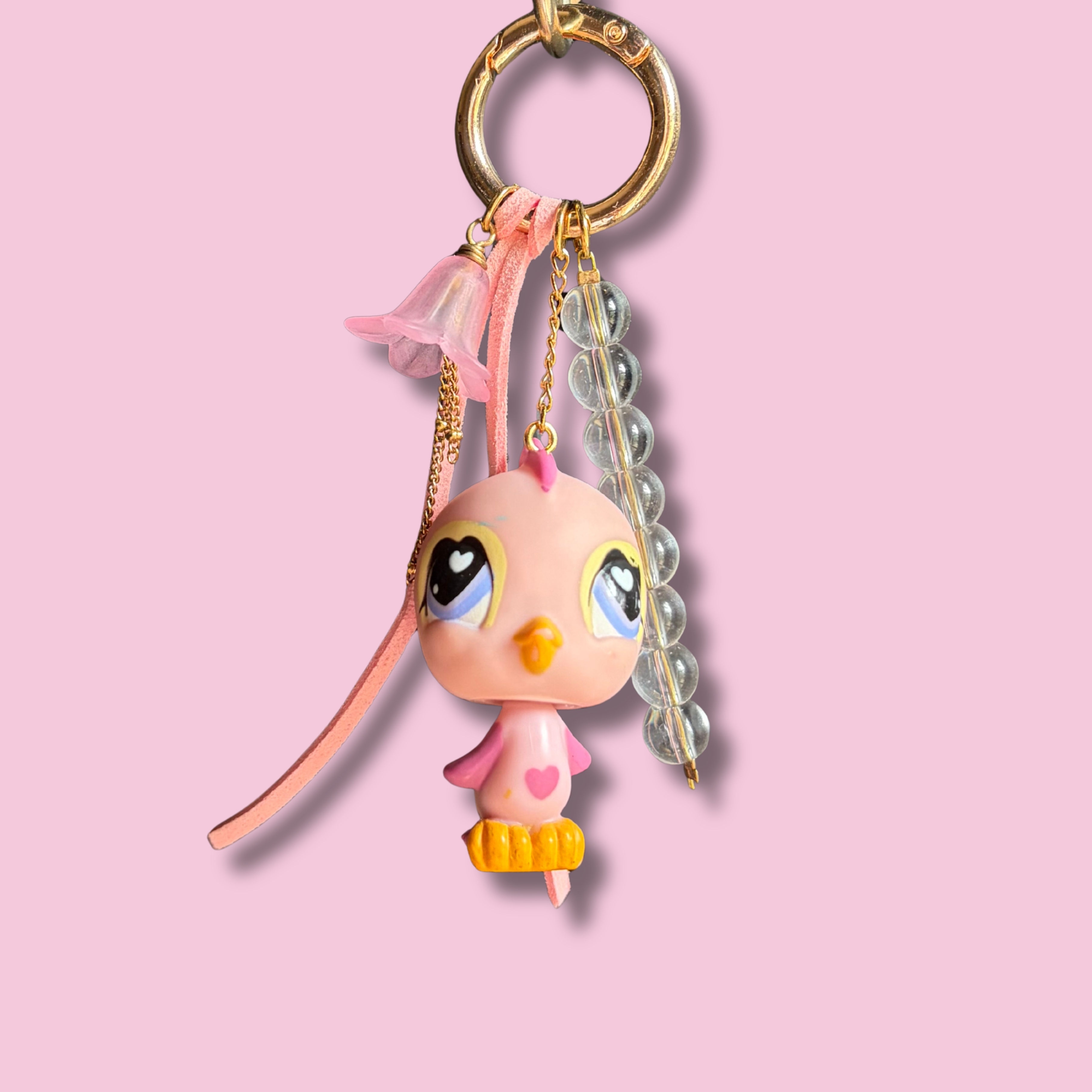 Bijou de sac Oiseau rose