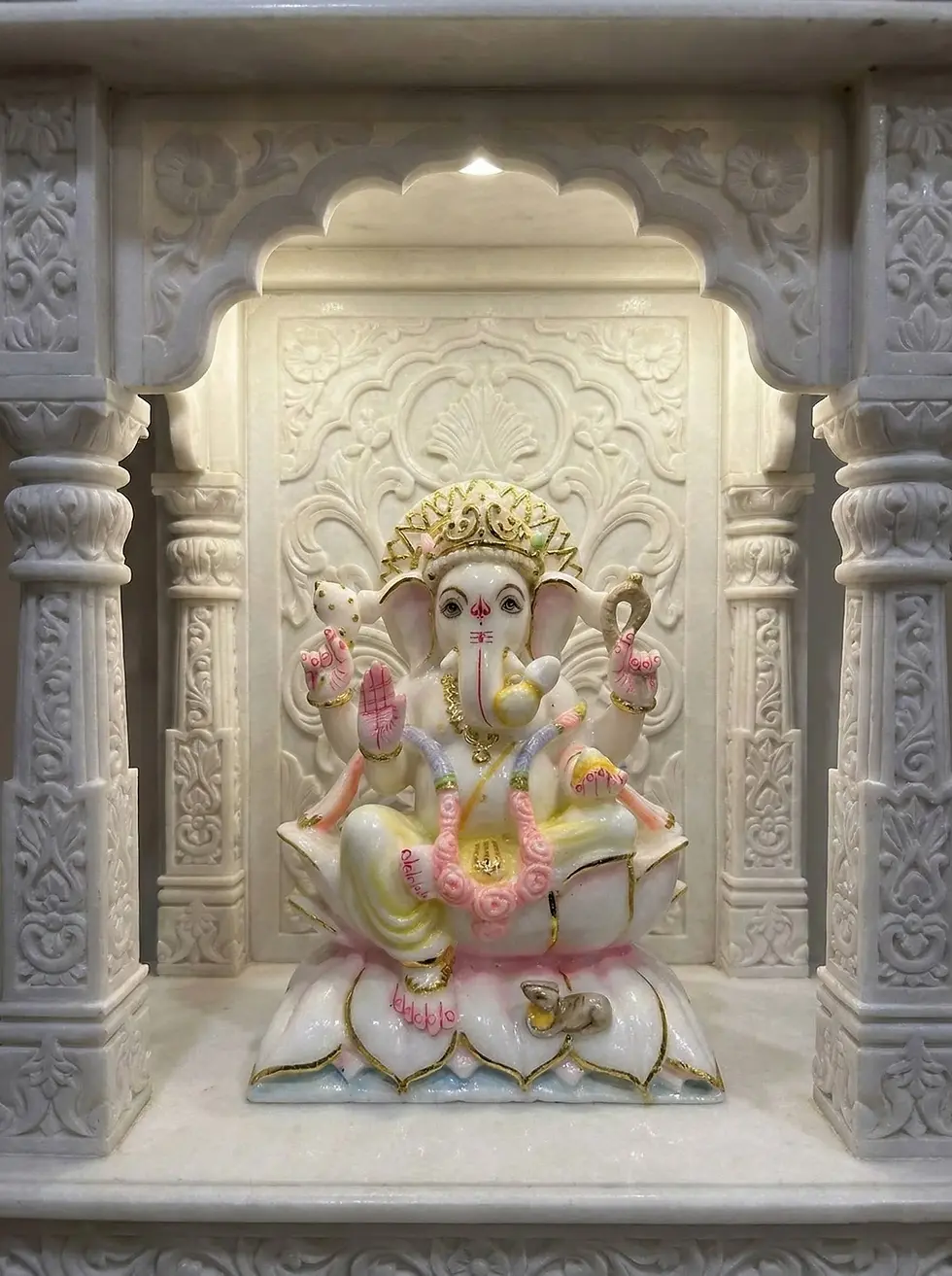 Eye-level view of a white marble Ganesha marble murti in a serene temple setting