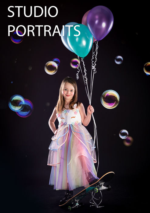 Composite Studio image of Girl on Skateboard with balloons and bubbles