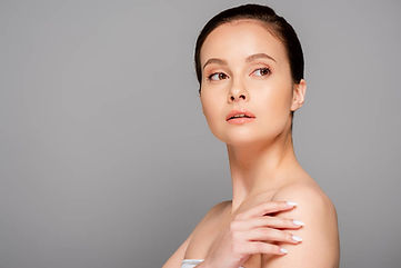 stock-photo-beautiful-woman-perfect-skin-looking-away-isolated-grey.jpeg
