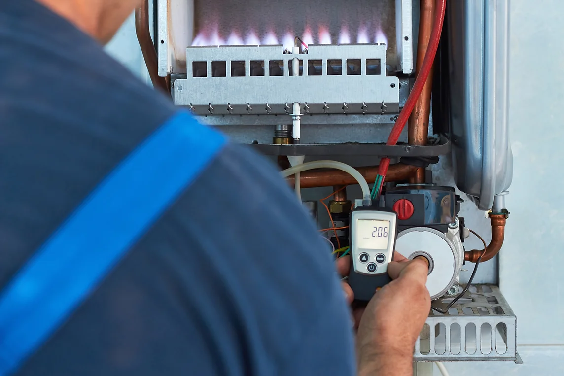 Repair of a gas boiler, setting up and servicing by a service department_ Adjustment of ga