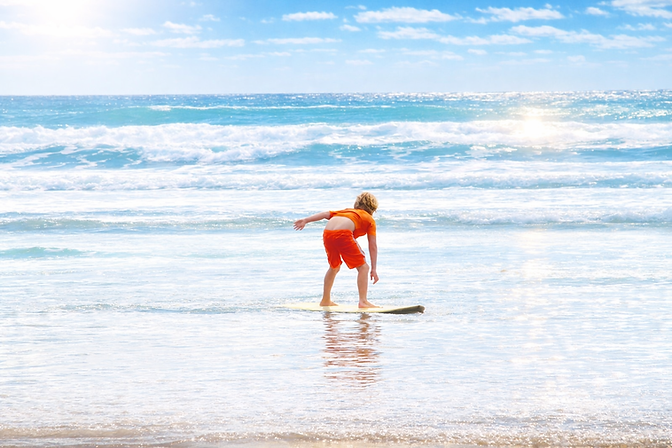 pismo-beach-skimboarding-kid-ocean-waves-villa-cortez.jpg.png