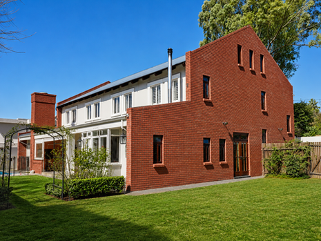 A Brick House Warmed Up With Timber and Tile
