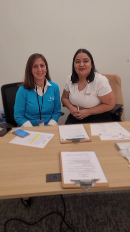 Staff Member & Volunteer Smiling