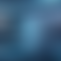 "A futuristic visualization of AI-powered B2B content creation. A glowing holographic blue brain hovers over a desktop keyboard, connected by data lines to floating icons and text labels for BLOGS, VIDEO SCRIPTS, CONTENT OPTIMIZATION, and SOCIAL MEDIA tasks."