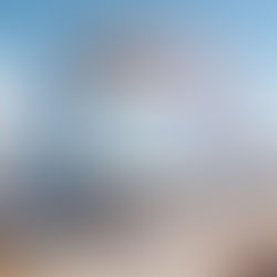 Modern glass and gold five-story building on a busy harbor front, symbolizing a well-constructed, scalable, and profitable business structure .