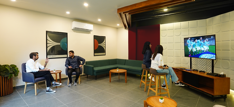 A lounge where people are gaming.