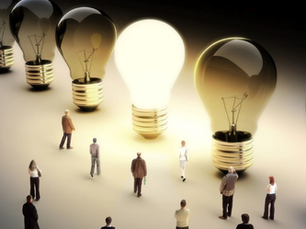 A row of life-sized bulbs, with one glowing brightly as people are drawn towards a stand out bulb.
