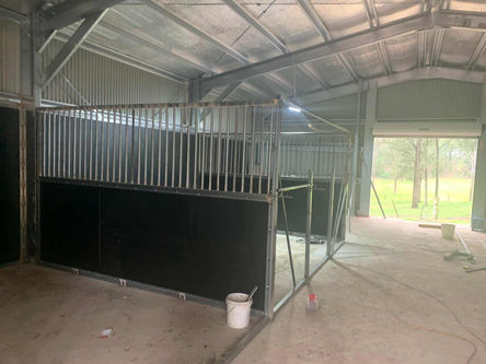 Framing internal horse stalls in steel shed construction