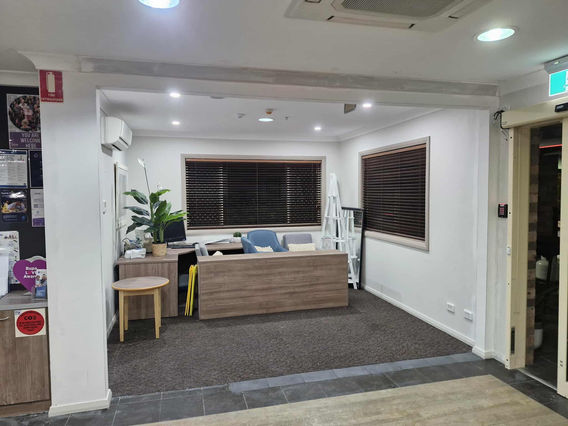 New wall opening created to expand reception and waiting area space.