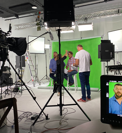 Strategic campaign producer on a green screen film set.