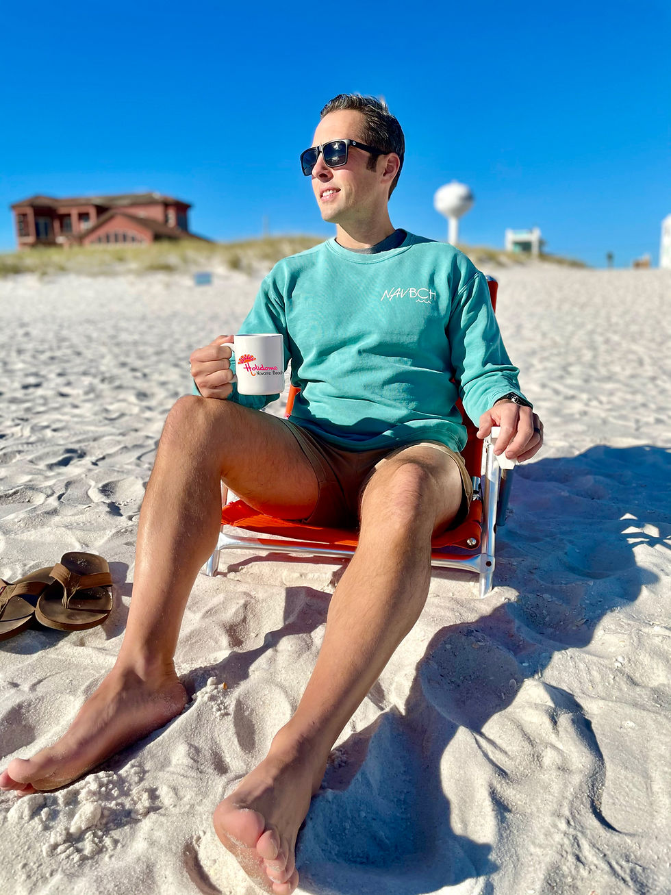 Thumbnail: Man on Navarre Beach lounge chair wearing NAV BCH Crewneck Sweatshirt in Seafoam color