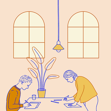 mixkit-two-artists-working-at-a-shared-d