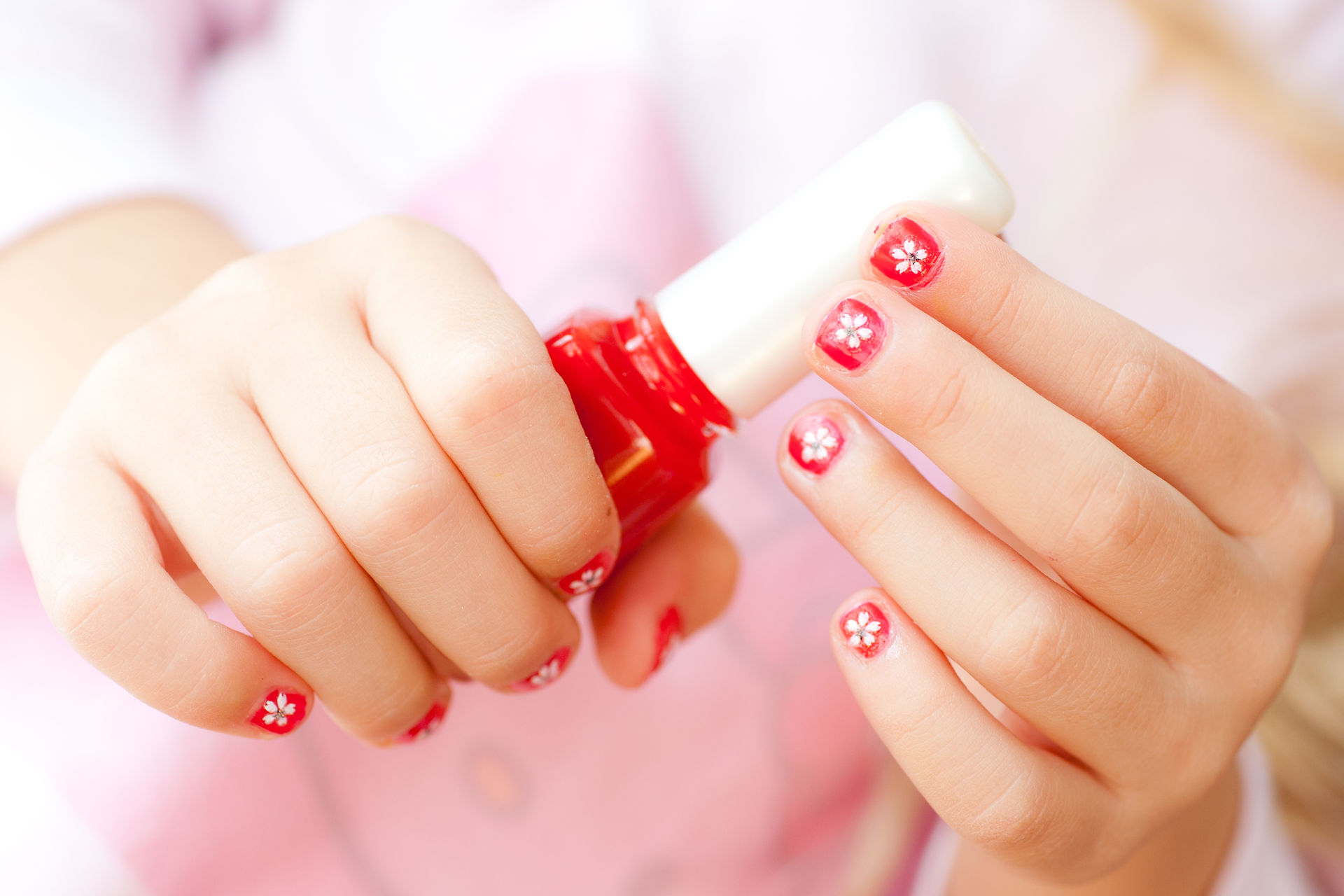 girl holding nail polish