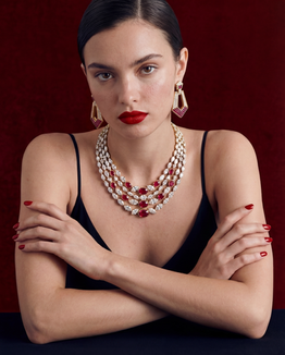 Sculptural Gold

Editorial portrait highlighting a bold gold bracelet and earrings with striking red lipstick.