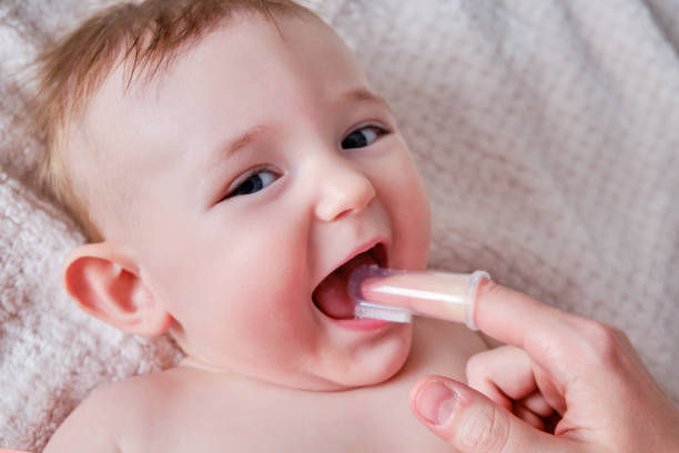 Brushing with silicone finger toothbrush