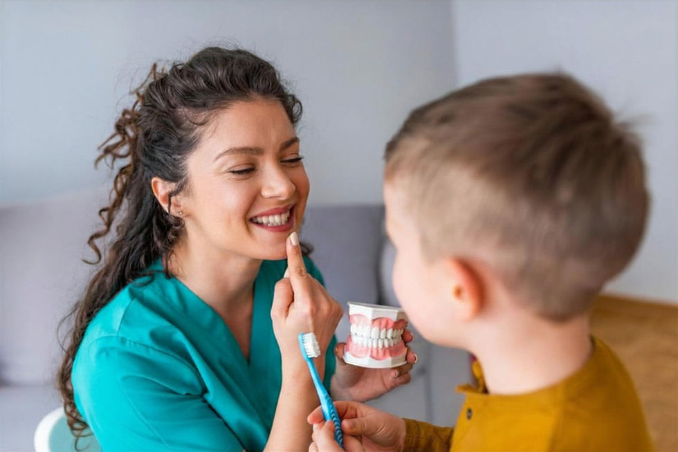 A dental nurse showing teeth to a child