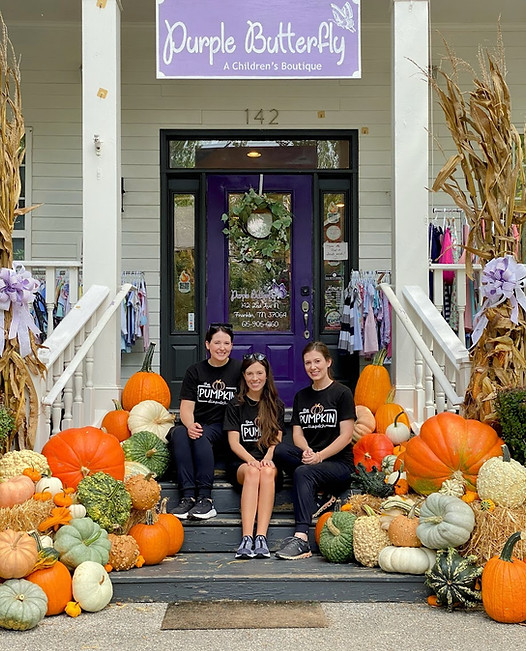 Image of The Pumpkin Dispatch Owners sitting on a porch
