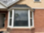 Close-up of a newly installed replacement window inside existing siding