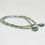 Miniaturbild: Armband Scarabäusgrün und Gold mit kleinem Brickstichanhänger