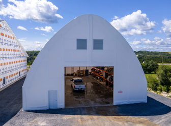 Tension fabric building