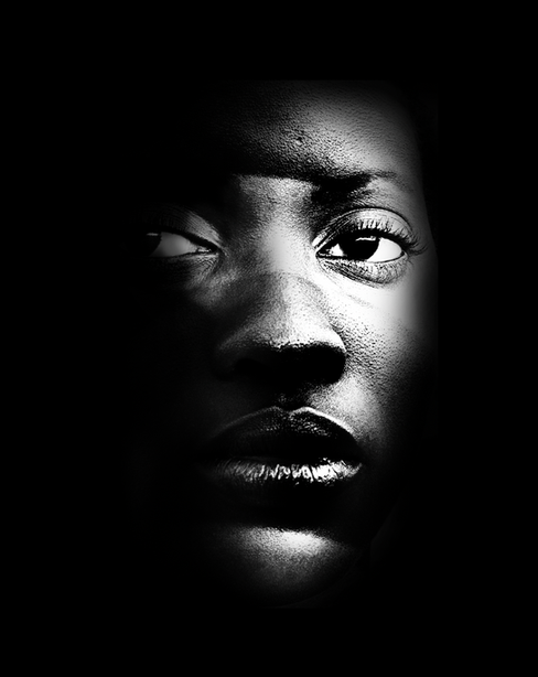a black and white photo of a woman 's face