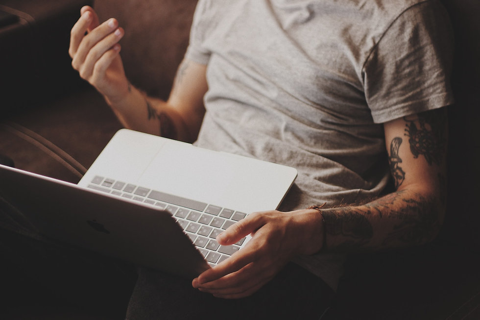 Man engaging is an online psychotherapy telehealth session